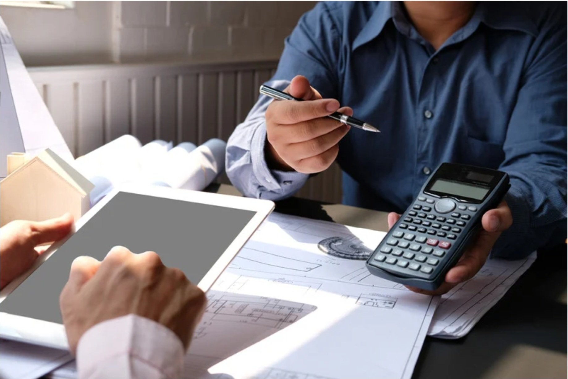 two people calculating the cost of something