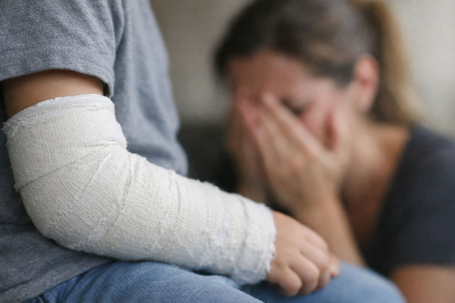 Childs Cast Arm with Crying Woman in Background-1