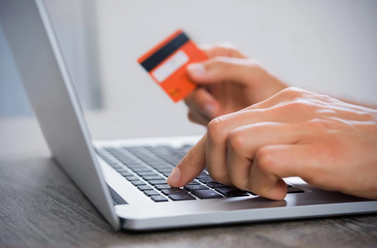 A person typing in their credit card information 
