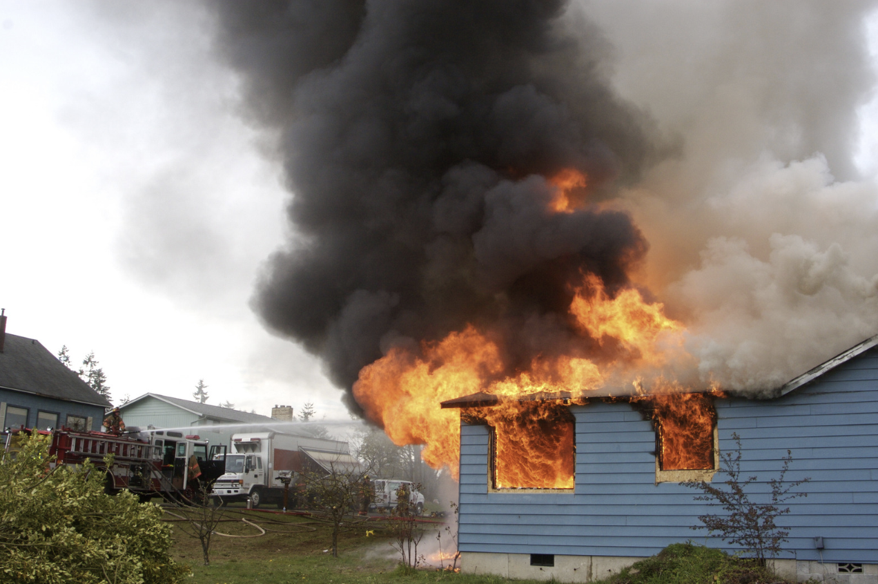 a house on fire from the actions of an arsonist 