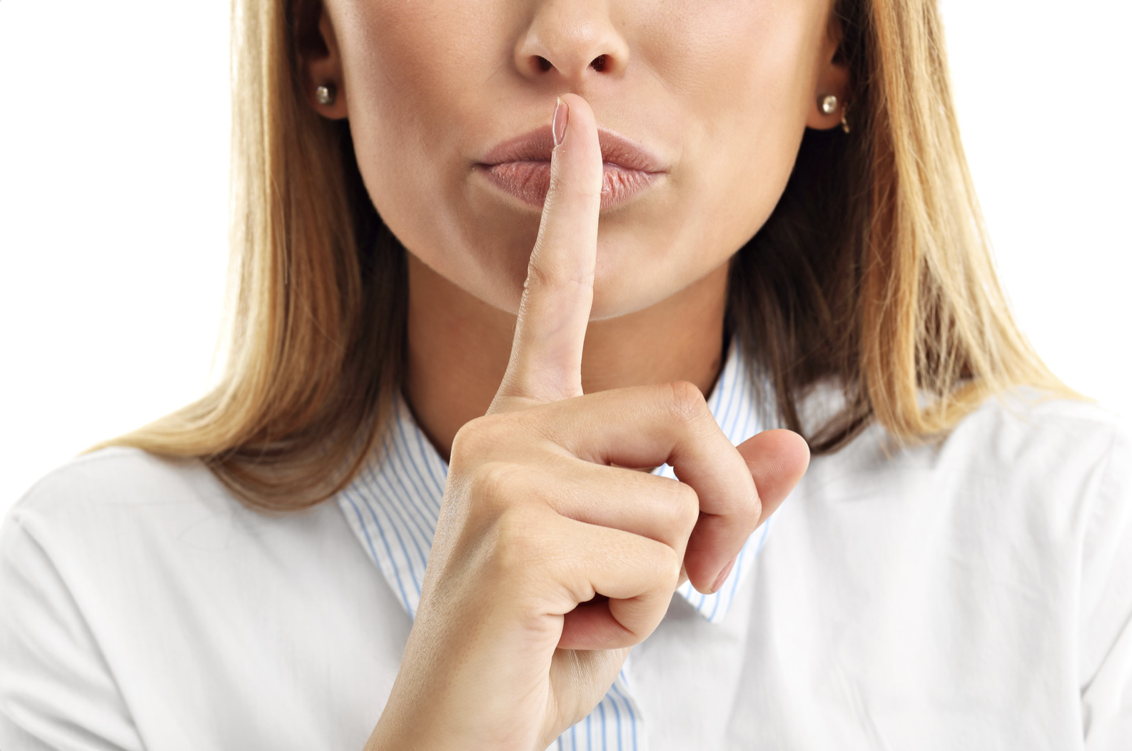 Person holding a finger to their lips