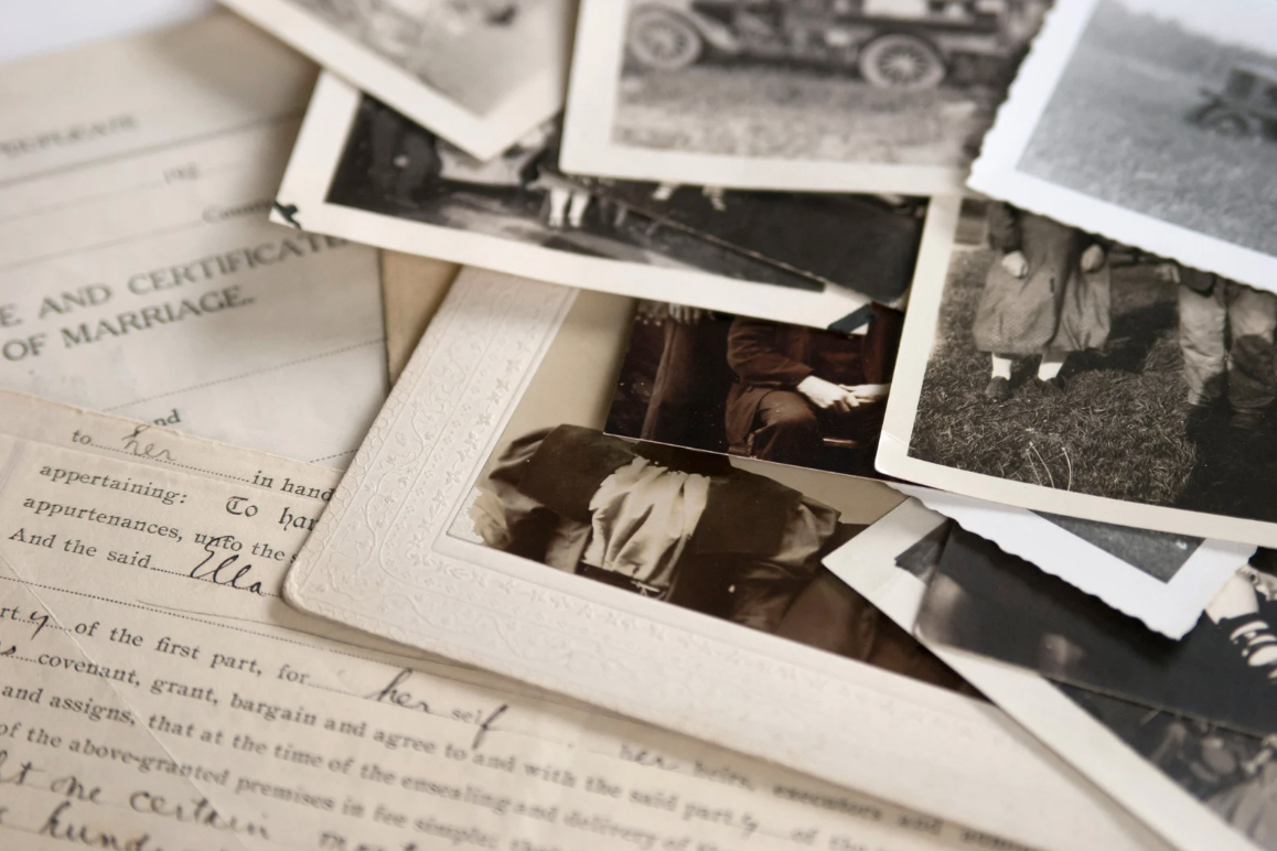 a pile of historical documents and photos