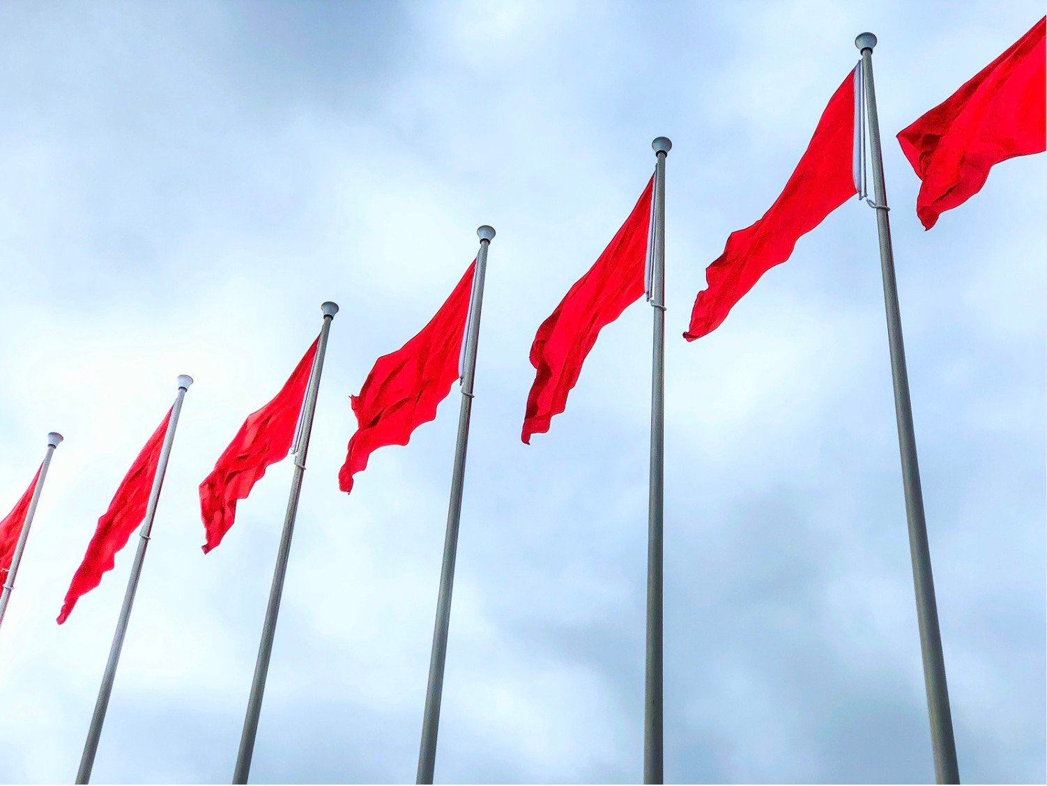 red flags waiving in the wind