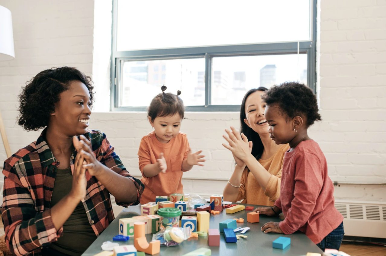 teachers playing with students in a. day care 