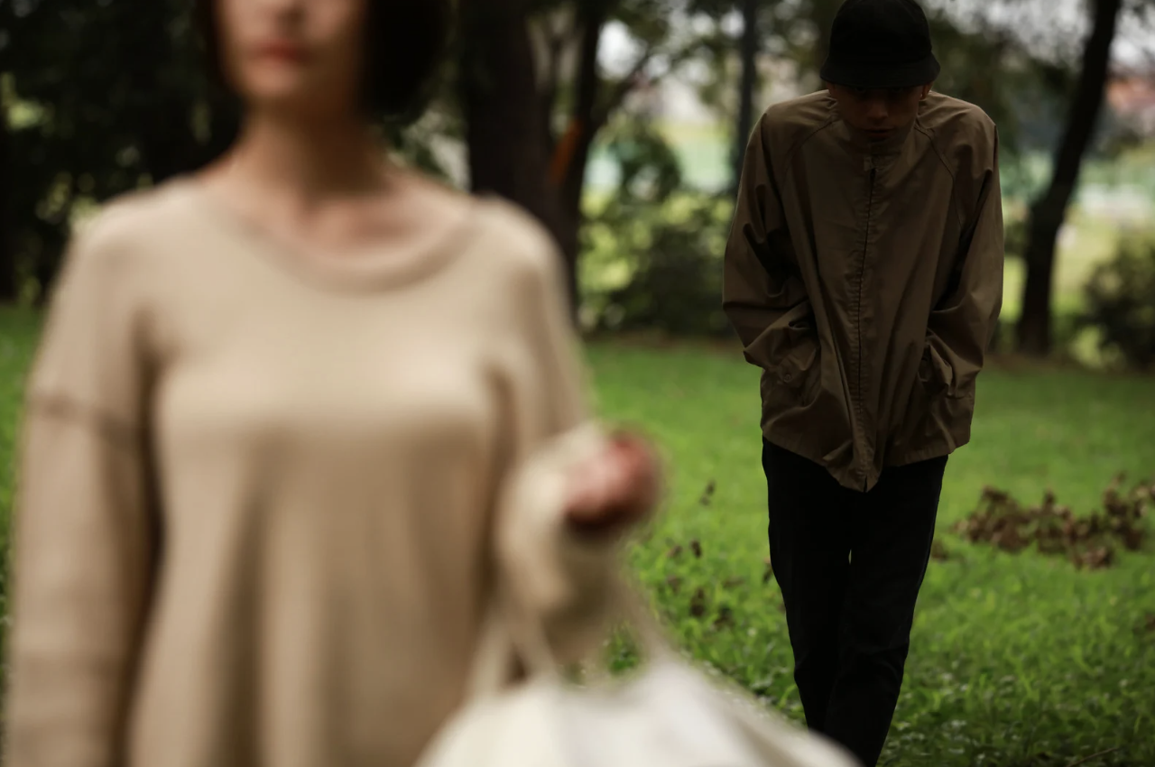 a man stalking a woman