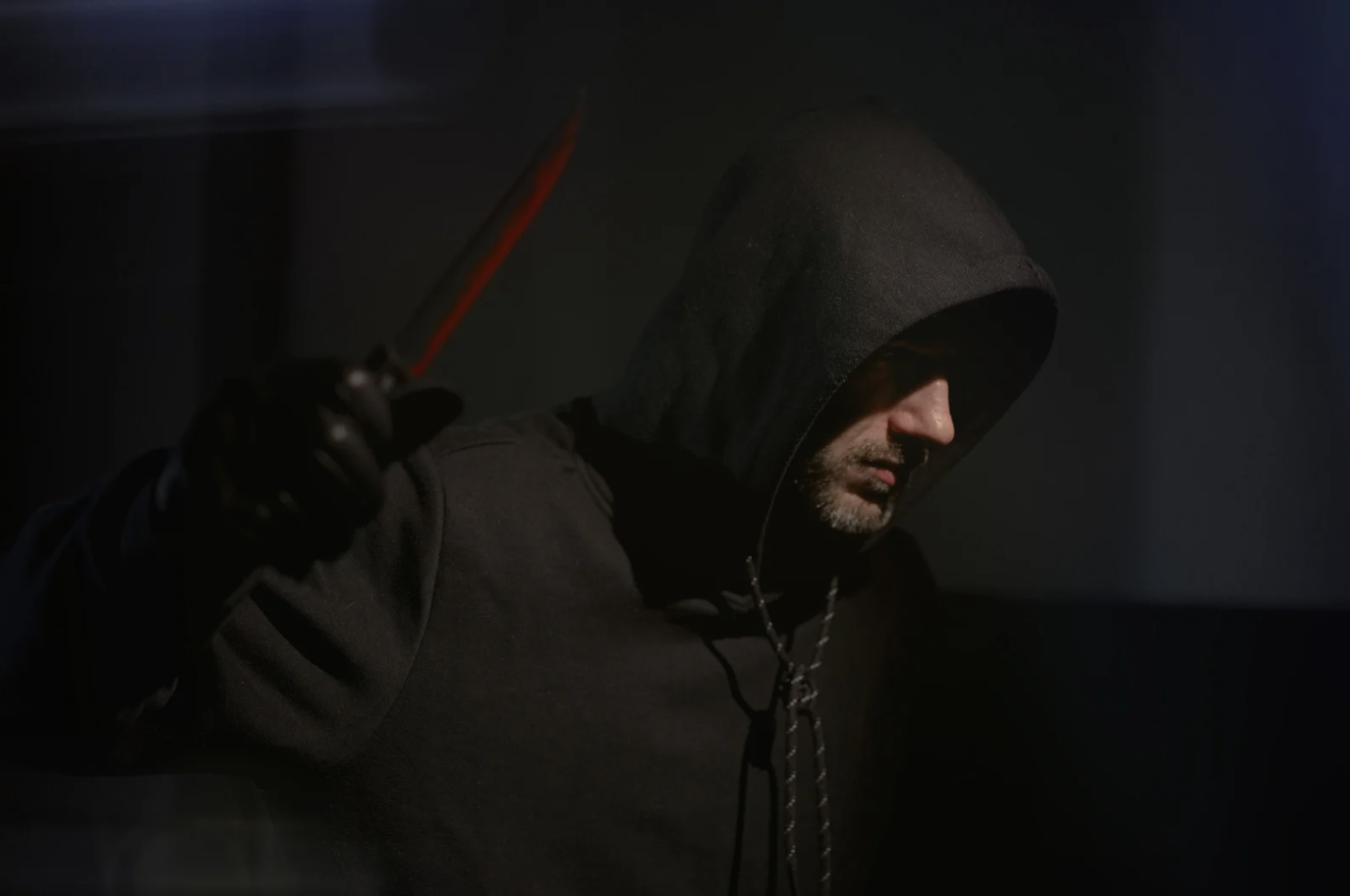 a man holding a bloody knife 