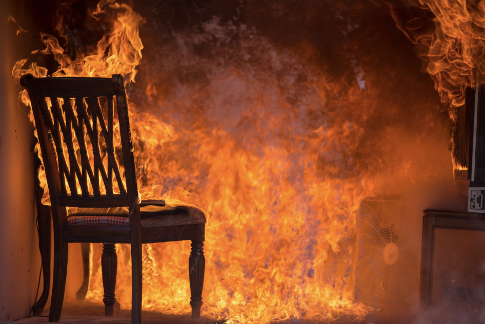 the living room of a house engulfed in fire