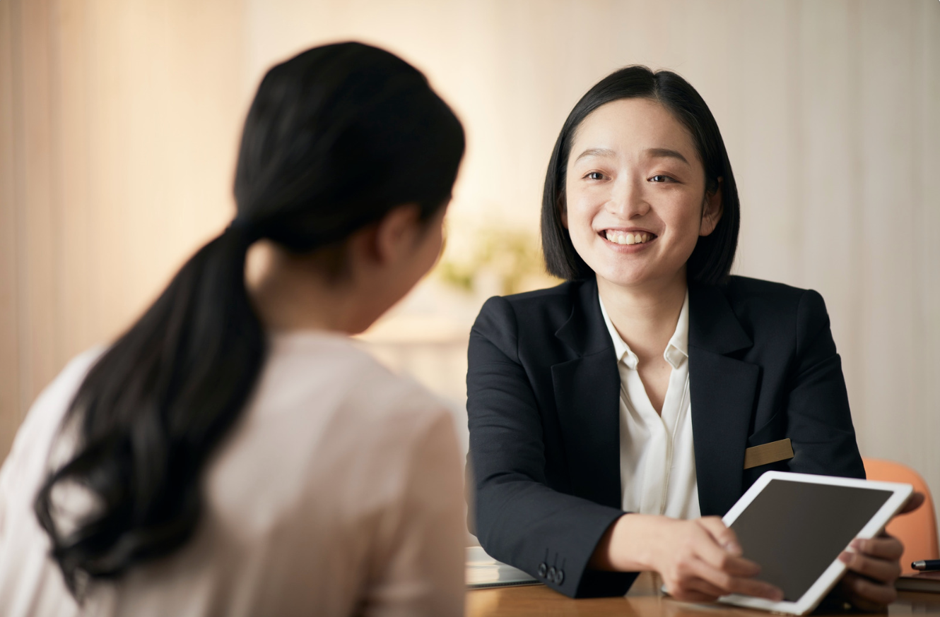 a business woman, showing information to a client