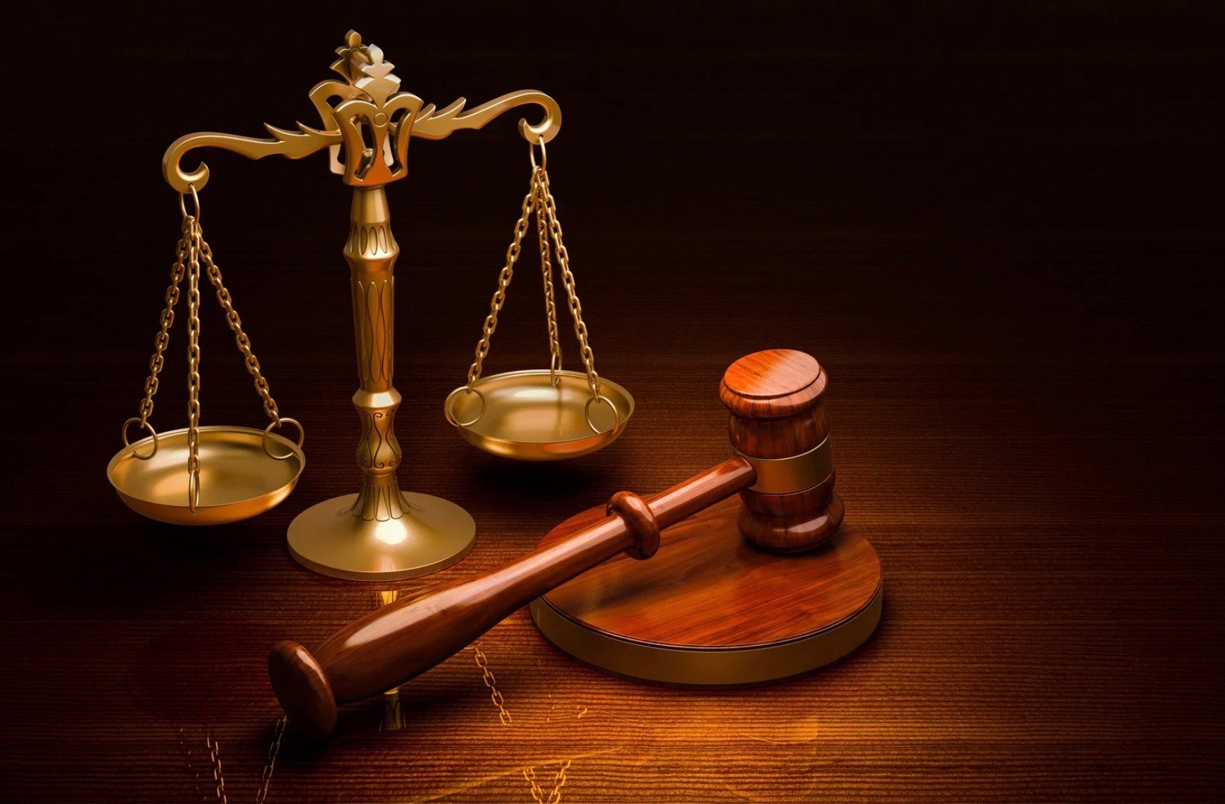 a judges gavel next to the scales of justice