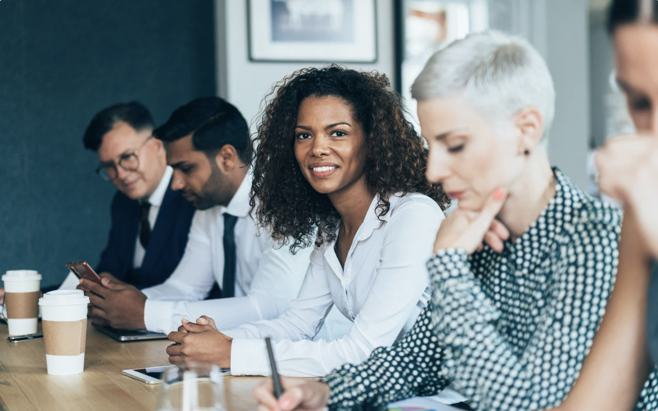 a groups of people in a meeting, going over important informations