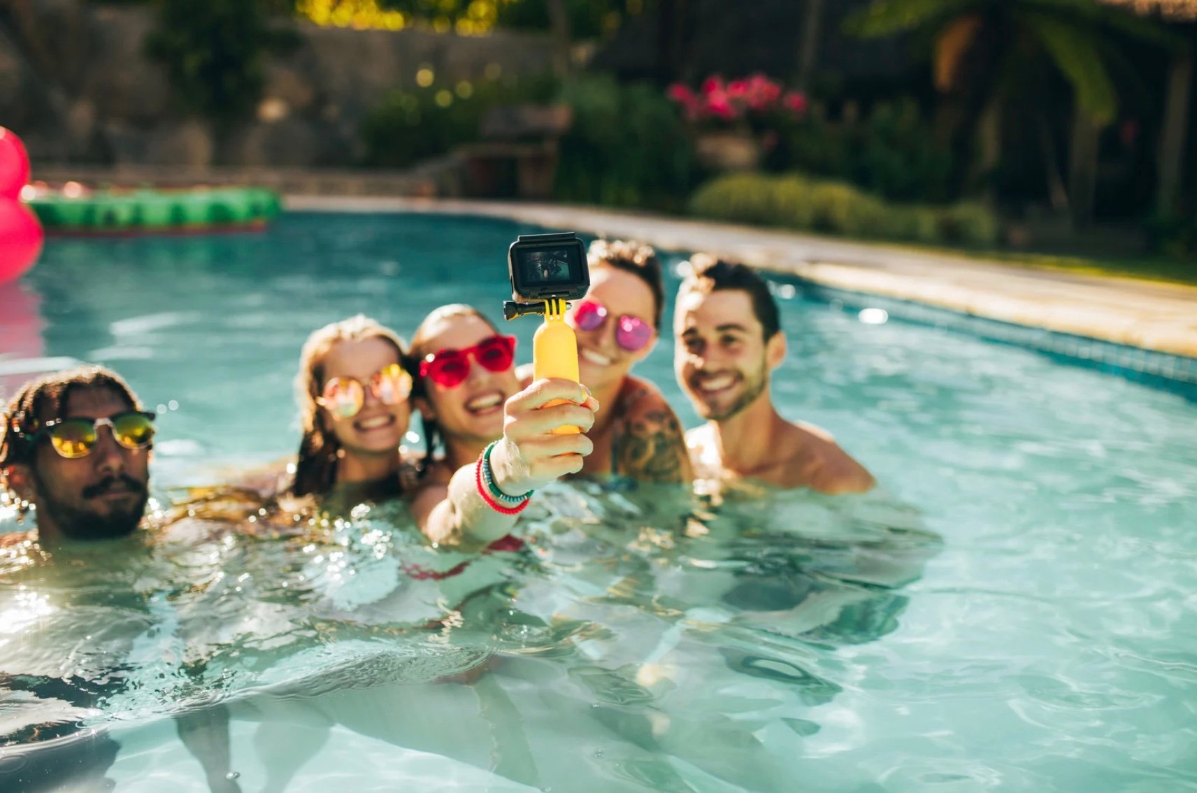 a group of people in a pool together 