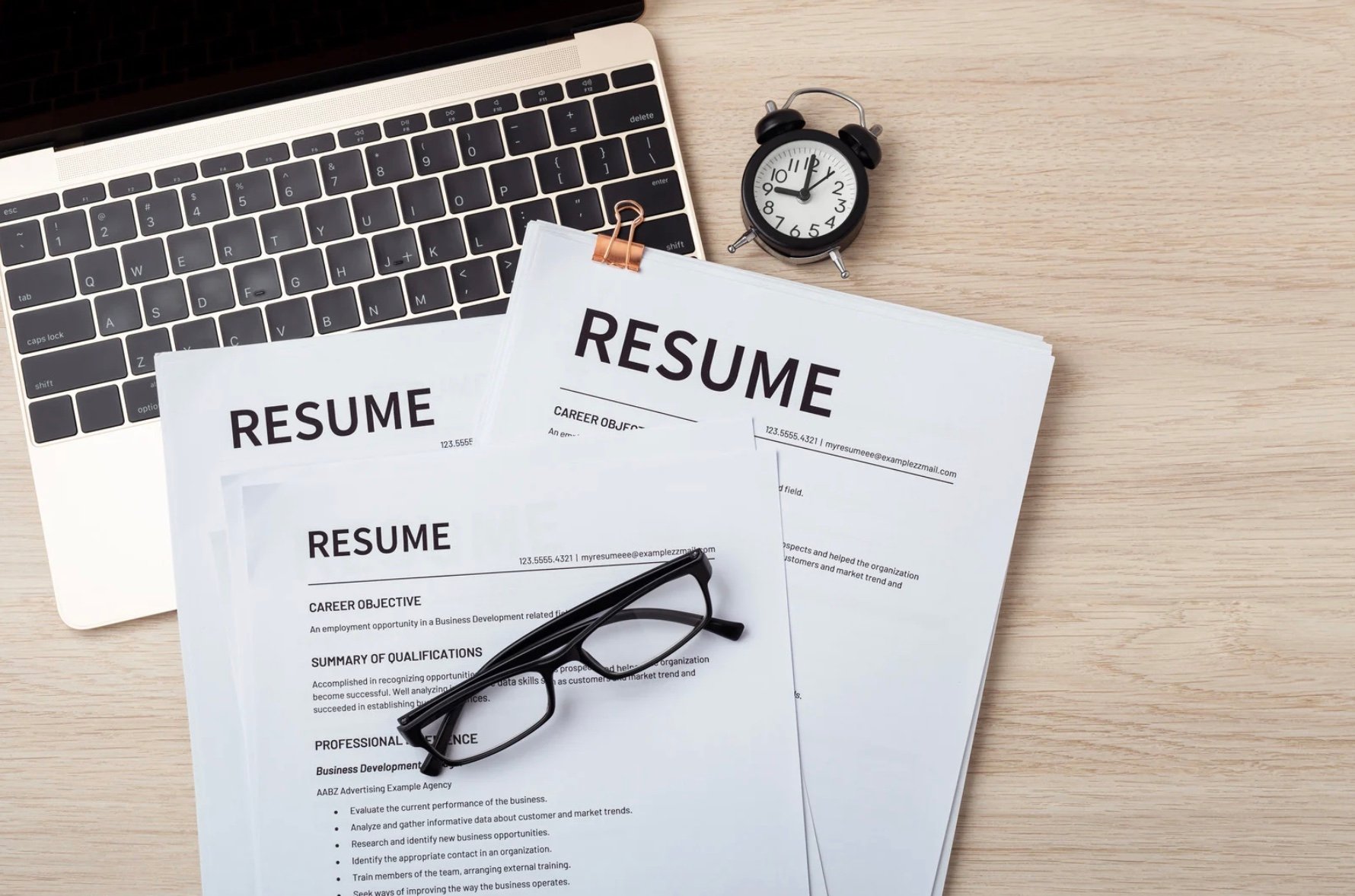resumes on top of a computer