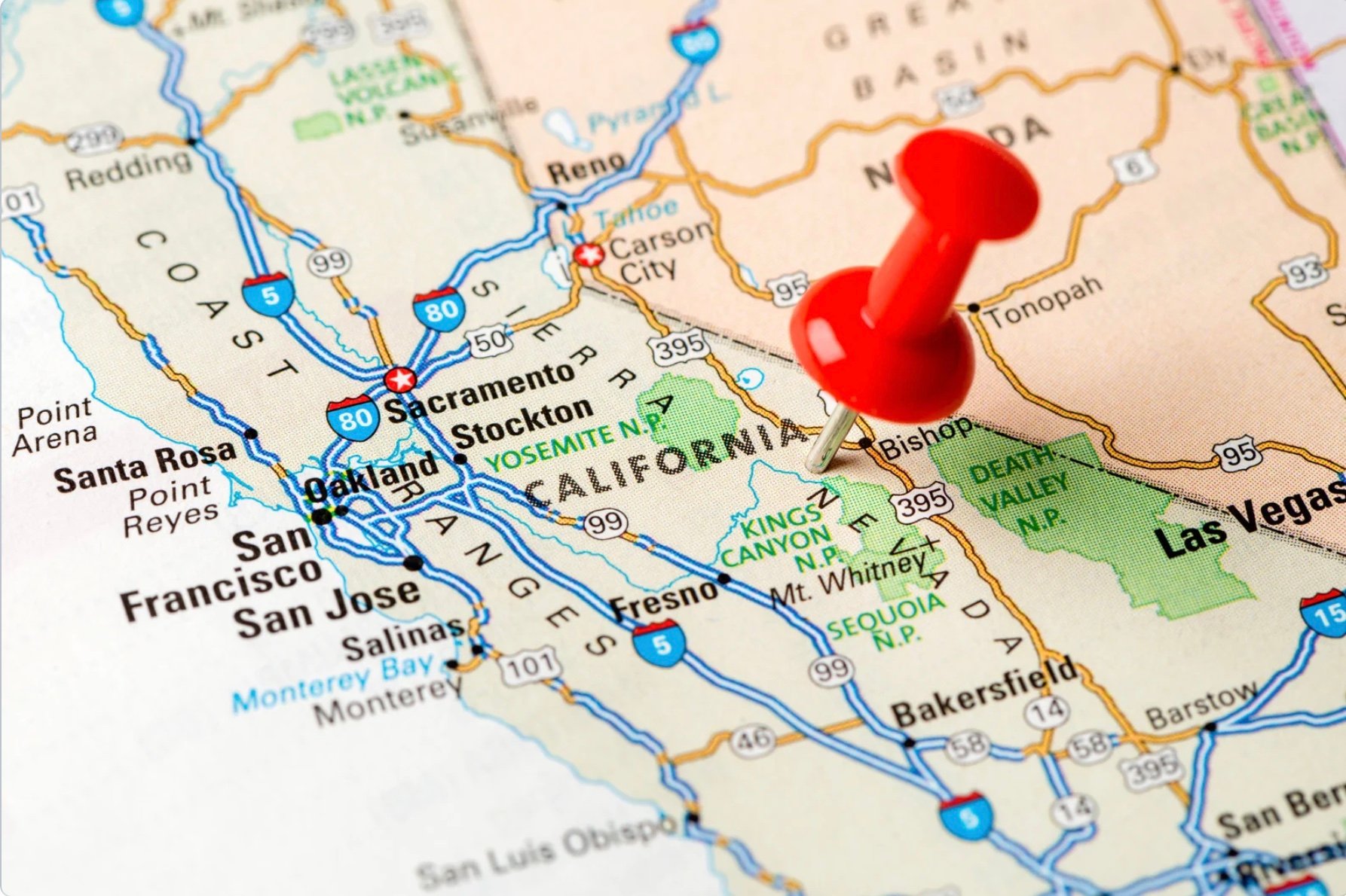 A map of the state of California with a push pin marking a location