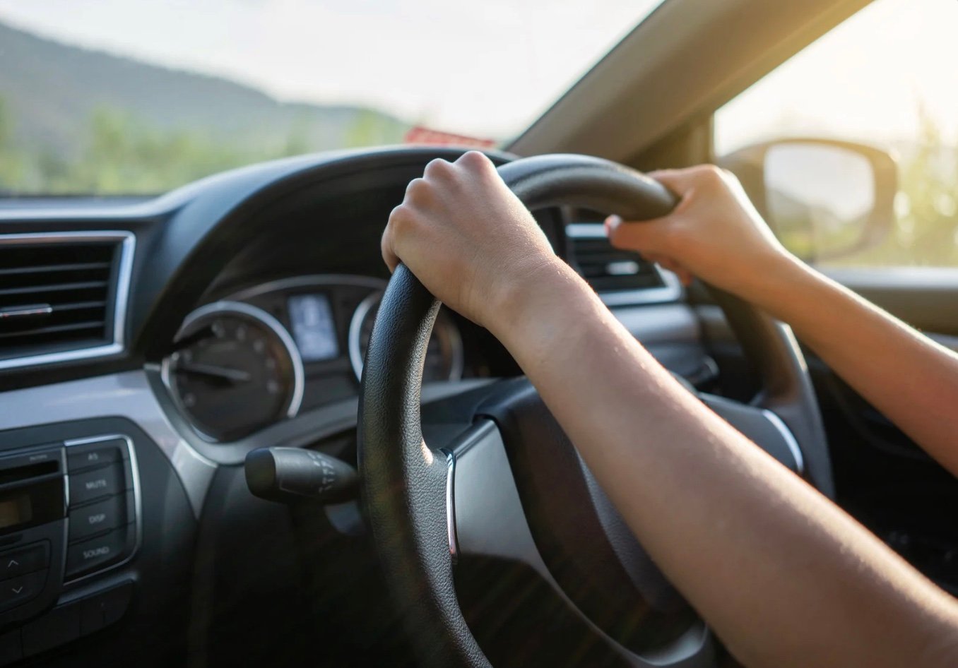 view of a drivers Hans open the steering wheel
