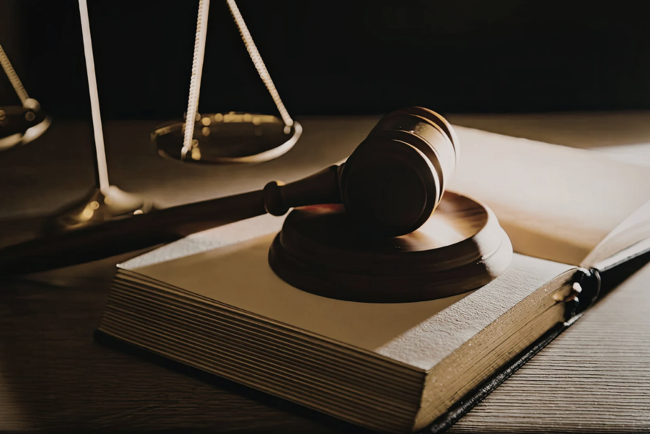 judges gavel on top of an open book