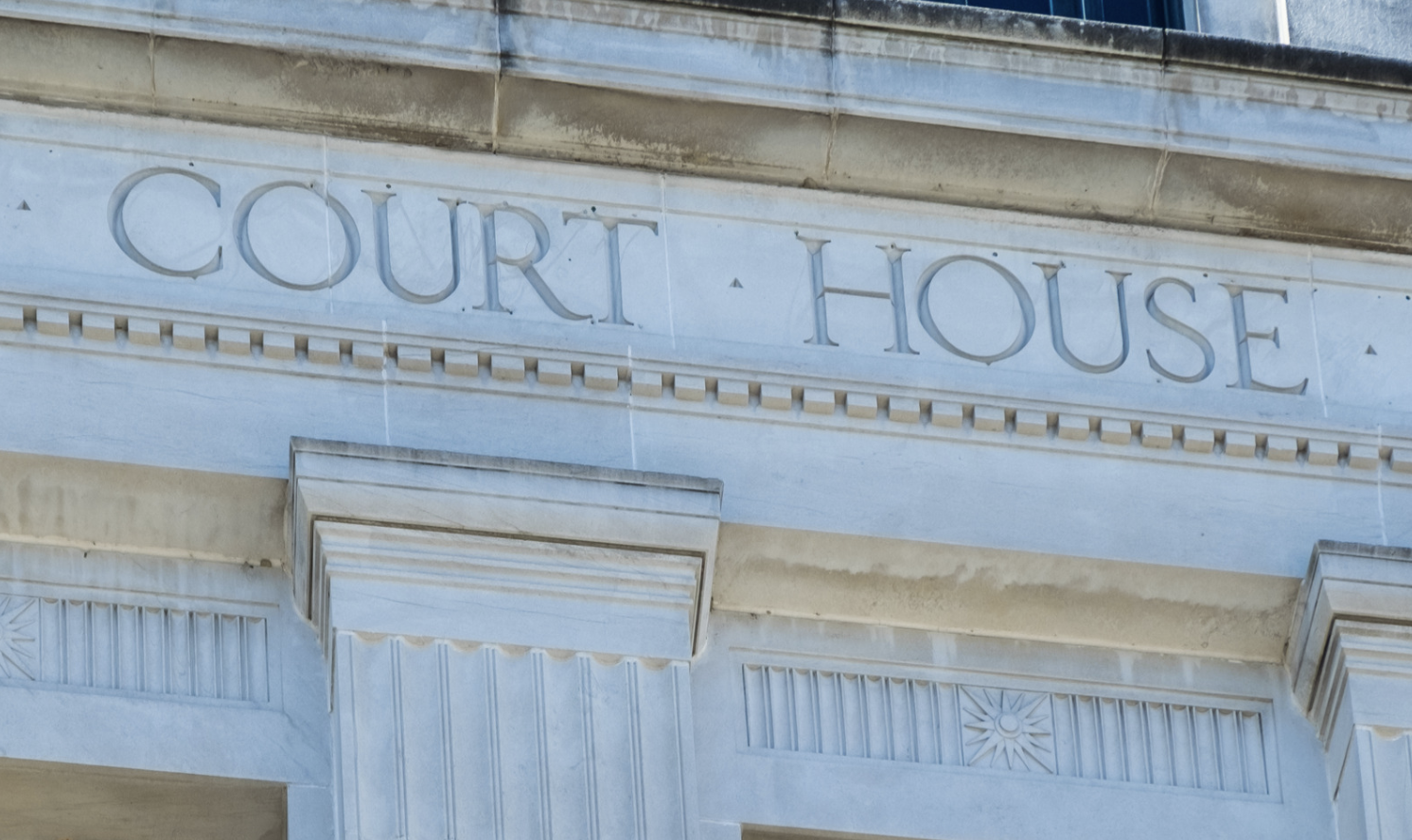 a close up panel of a court house