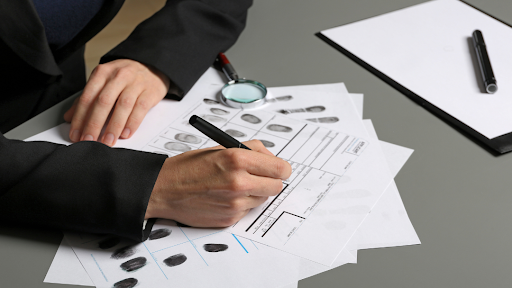 fingerprints on paperwork