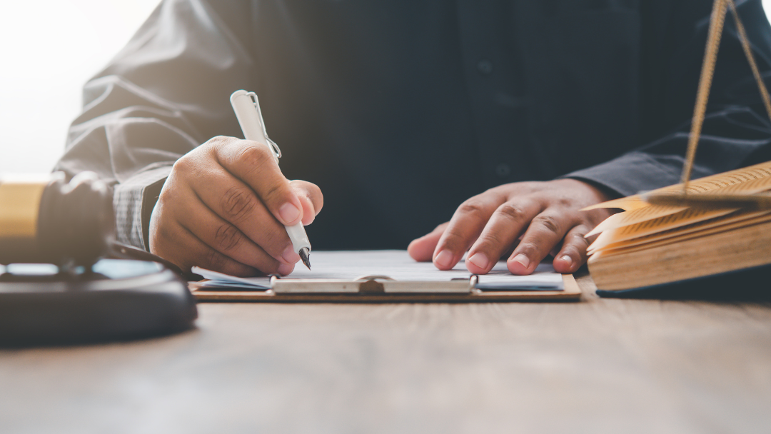 person signing paperwork