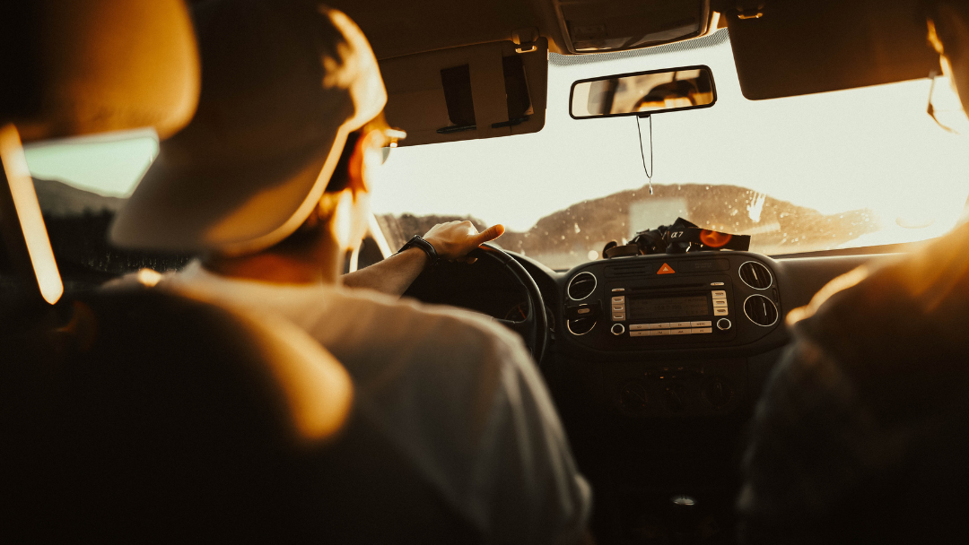 man driving a car