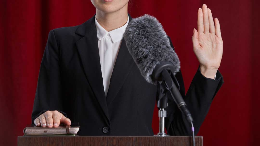 woman taking the stand