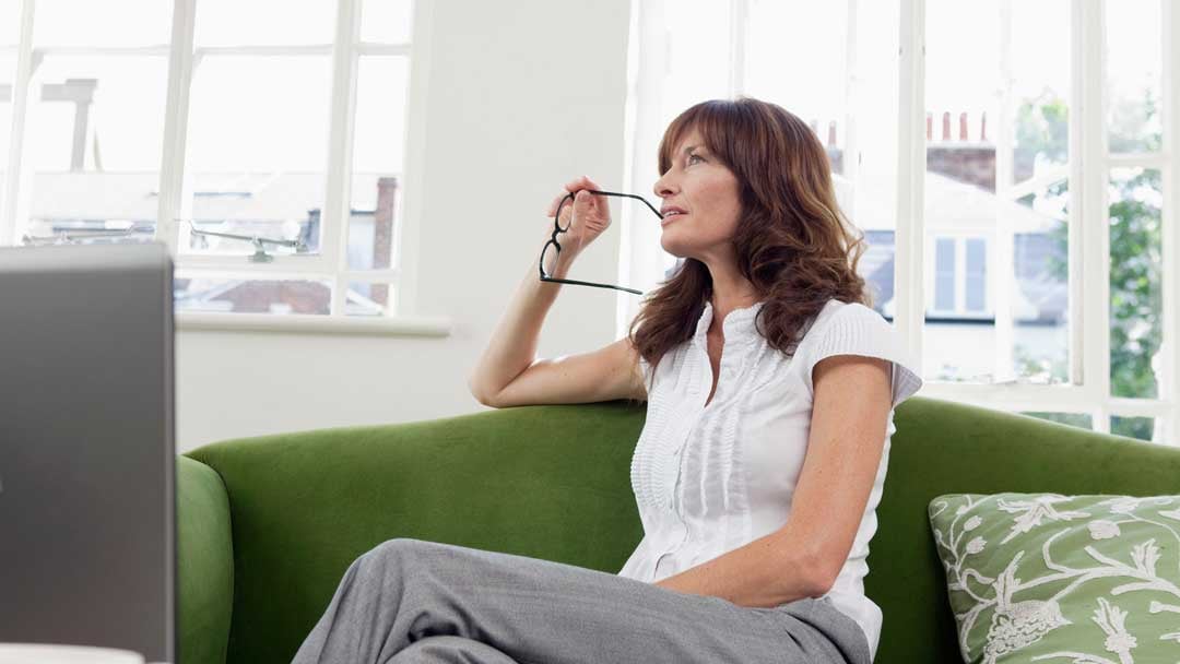 woman sitting on couch