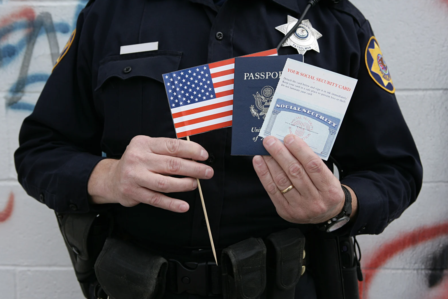 a federal employee holding a flag, a cook of the constitution, and a social security card