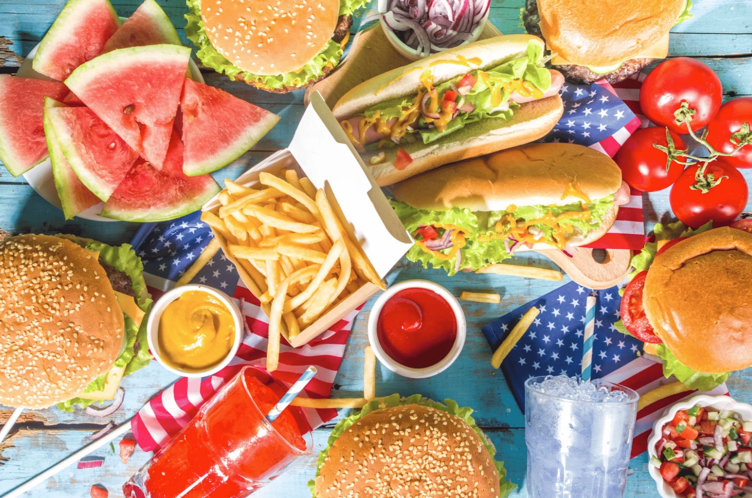 a table with americana food and fruit 