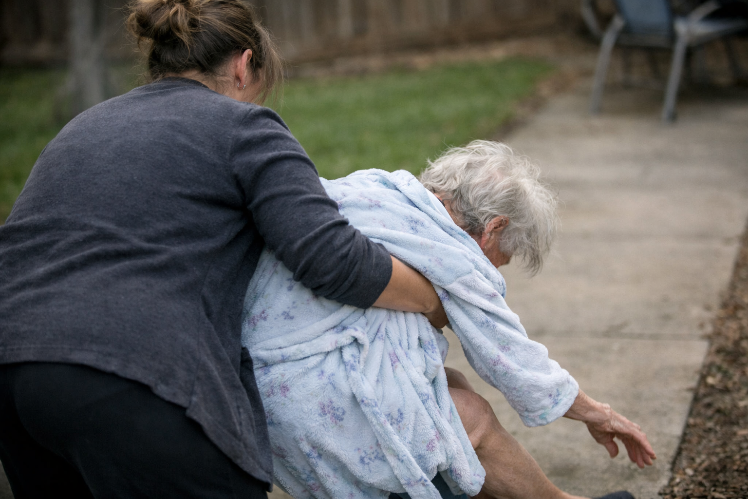 Elderly Woman Falling from Womans Arms