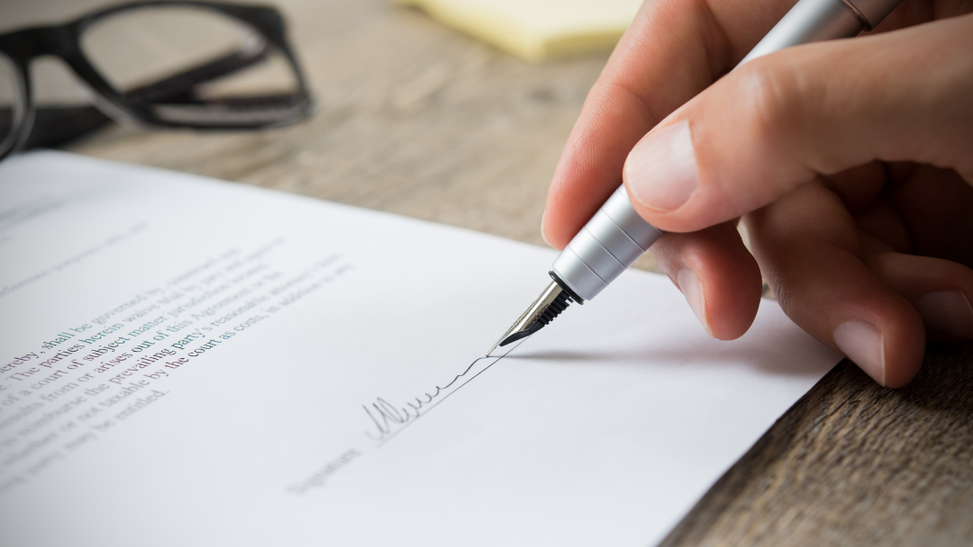 a person cosigning a document